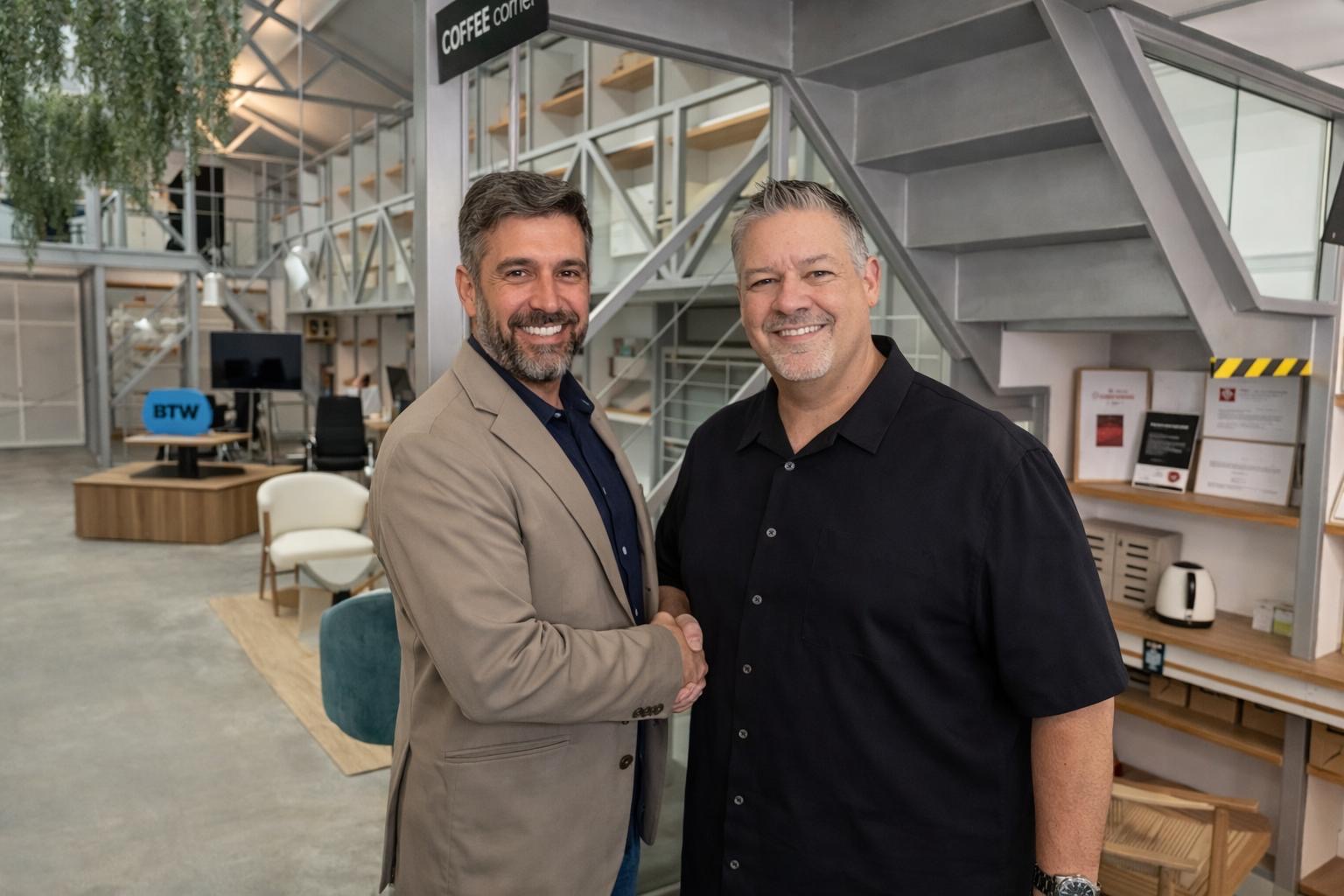Juan Zamora, General Manager of Hopla, and James DeCesare, CEO of HyperSphere Technologies, shaking hands